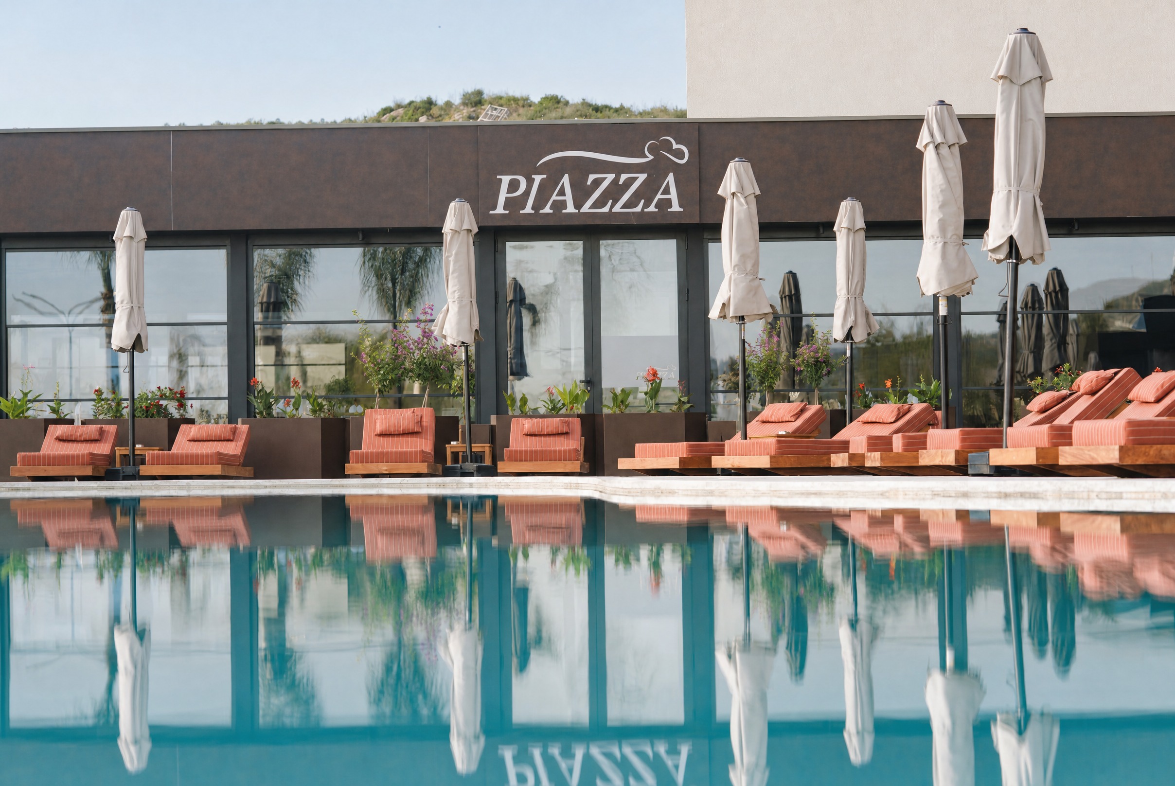 Piazza — the frontage mirrored in the still pool