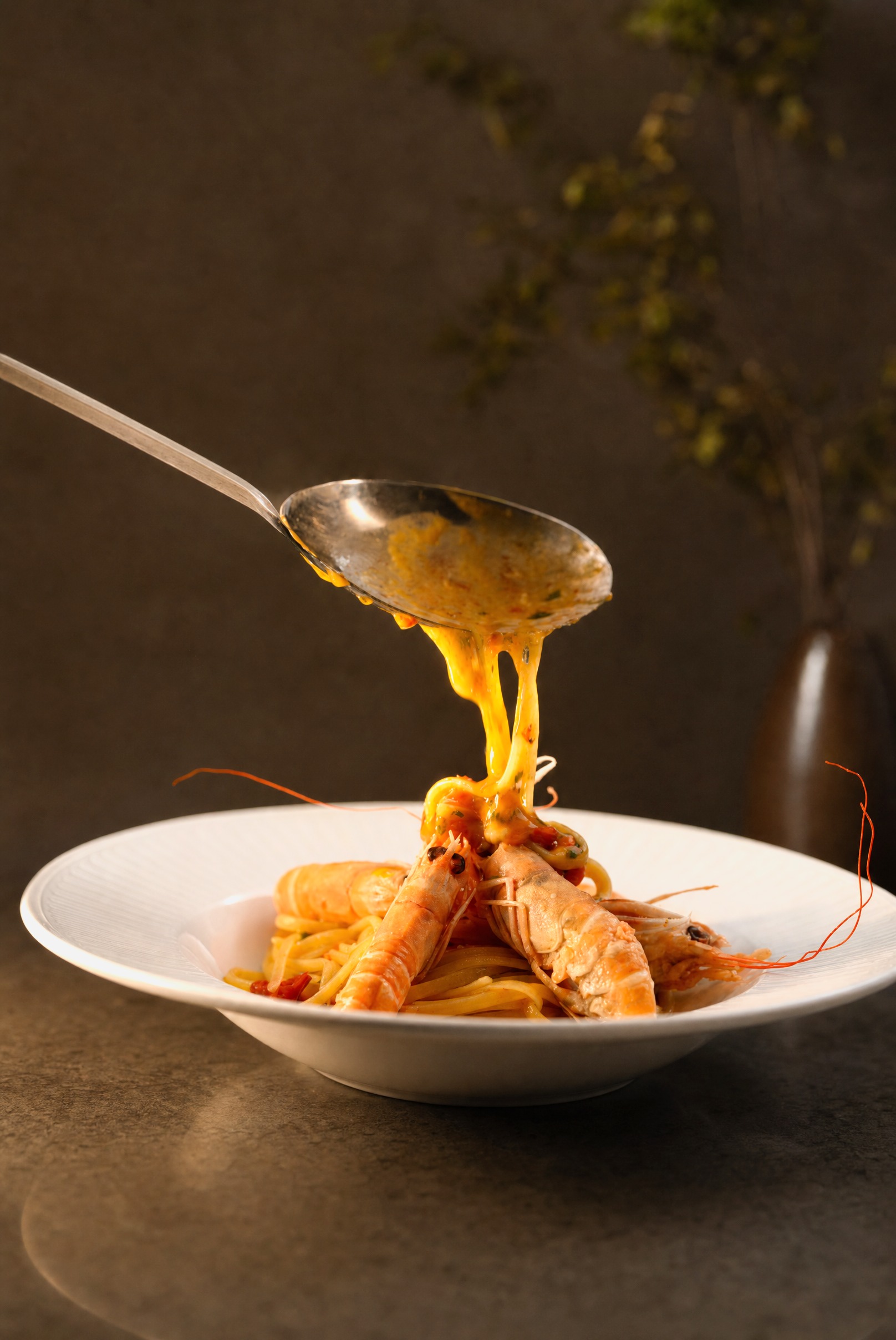 The kitchen — bisque poured over langoustines