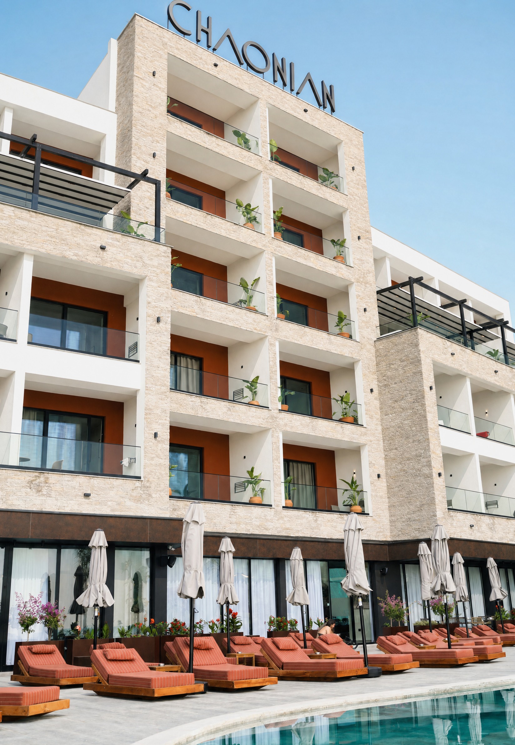 Chaonian Hotel — the pool terrace and its rows of terracotta loungers
