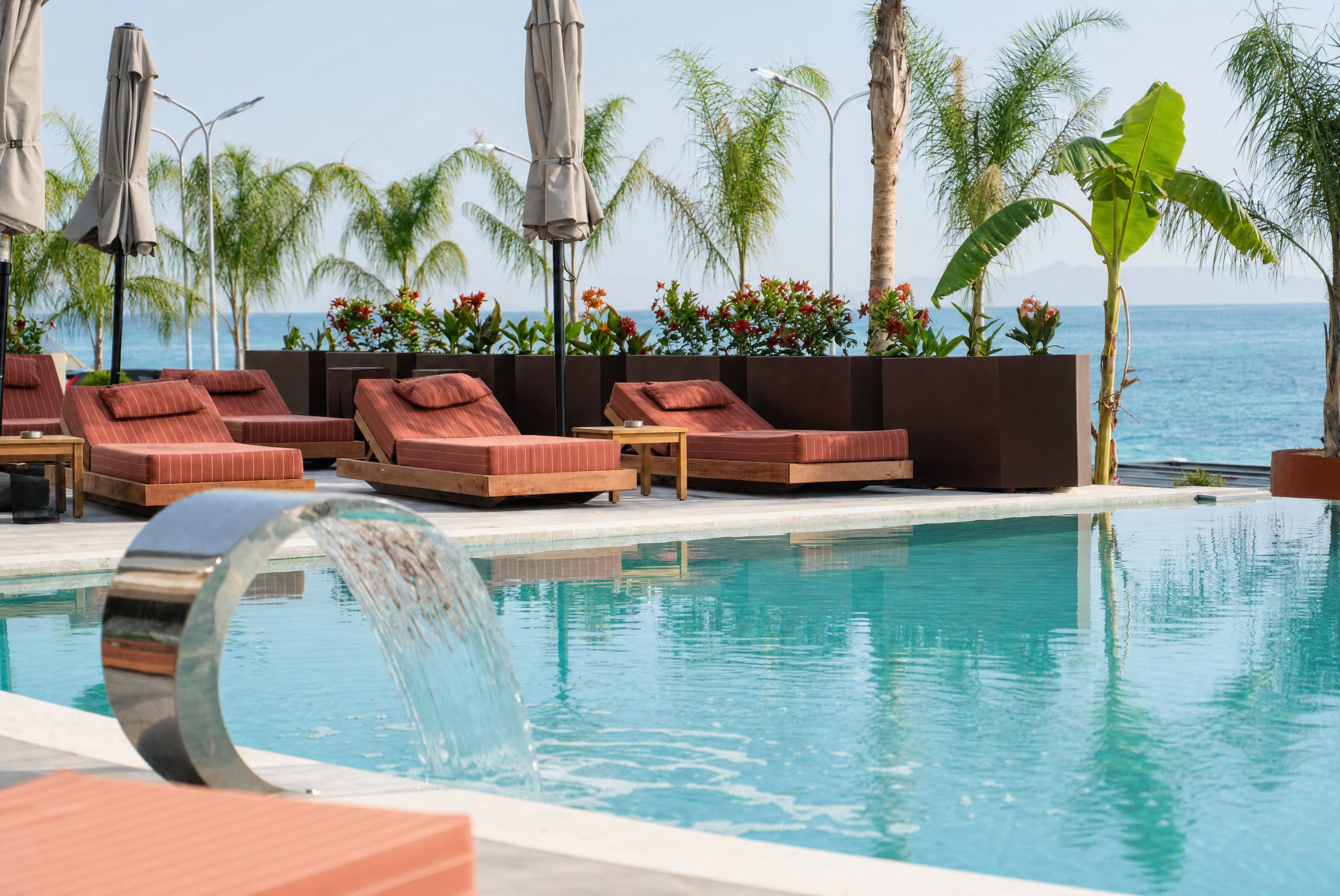 Chaonian Hotel — water cascade spilling into the pool