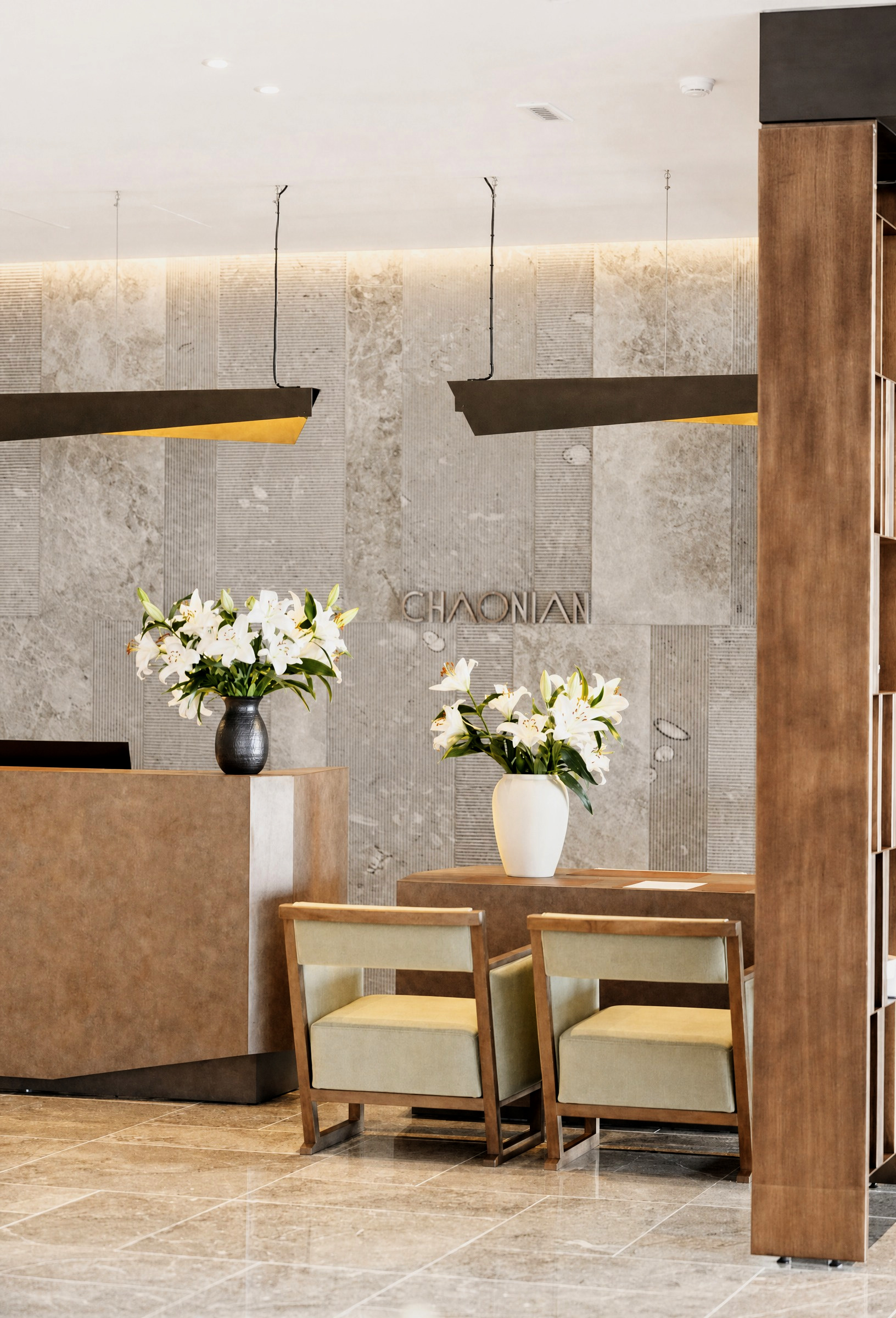Reception — the concierge desk dressed with white lilies