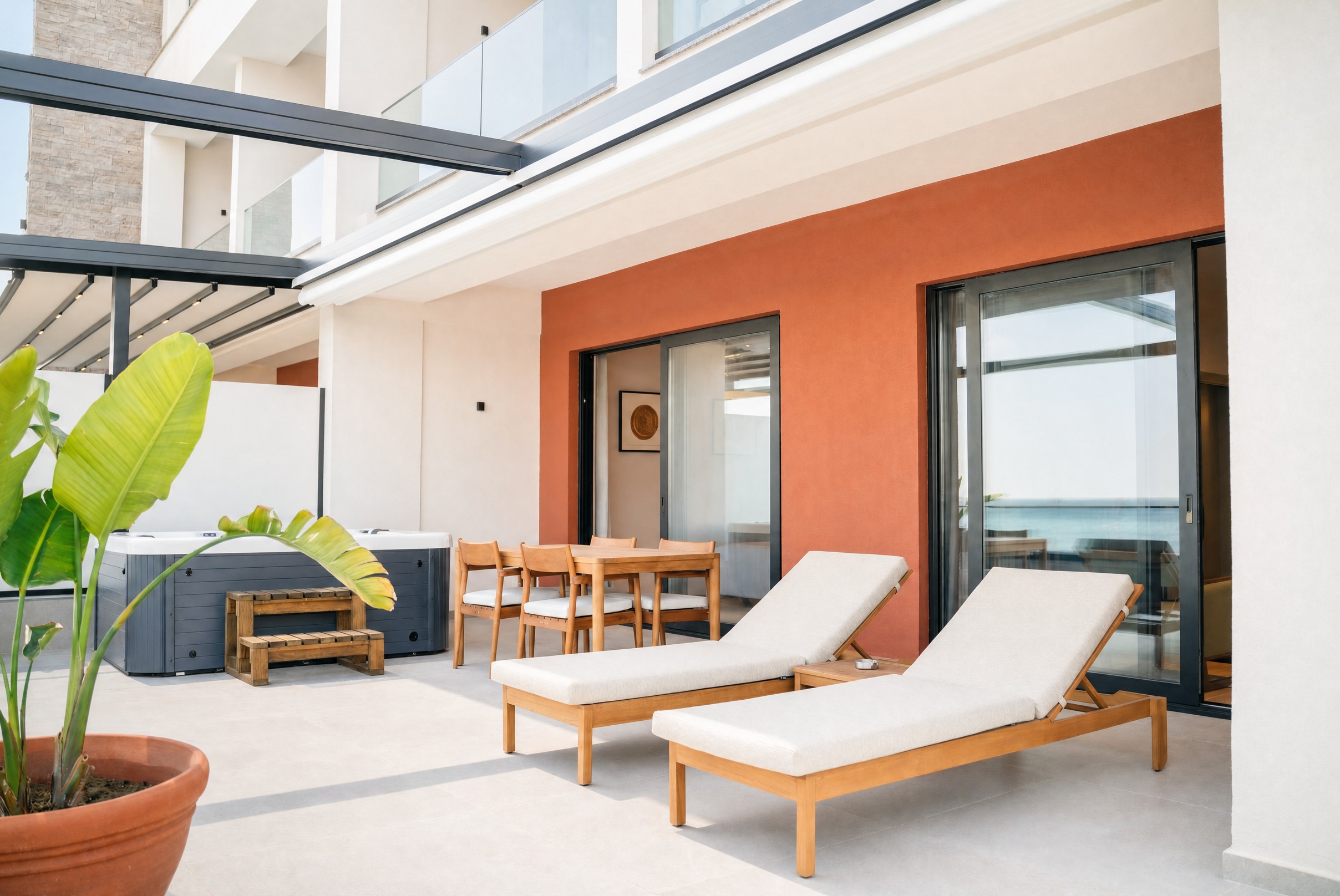 A Signature Suite terrace — preview of Rooms & Suites